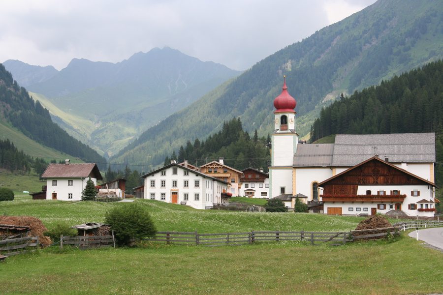 The village of Schmirn in Tyrol, Austria, with the parish church of St. Joseph and the rectory.